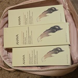 Hand cream, body cream, foot cream in pink travel case